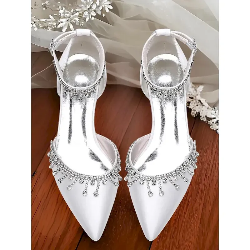 imuybu1741691455787.webp Women's White Satin Ankle Strap Wedding Heels – Pointed Toe Bridal Shoes with Crystal Drop Detail - Image 1